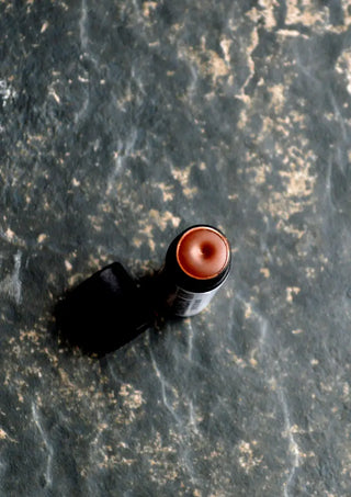 Our shea butter lip balm is coffee-flavored and packaged in an eco friendly lip balm tube.
