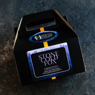 Men’s natural skincare gift set with beard balm, scrub, and moisturizer in eco-friendly packaging