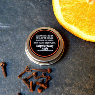 This orange clove beard balm is made with natural ingredients like beeswax and orange essential oil by Badgerface Beauty Supply.