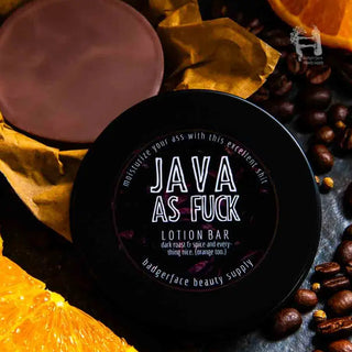 A coffee lotion bar is shown surrounded by coffee beans, oranges, and spices.
