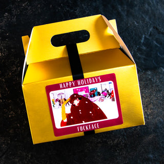 The label on this good white elephant gift set reads, Happy Holidays, Fuckface.