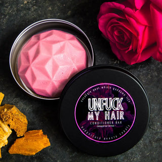 Nourish dyed or processed hair with this solid conditioner bar for damaged hair, made by Badgerface Beauty Supply.