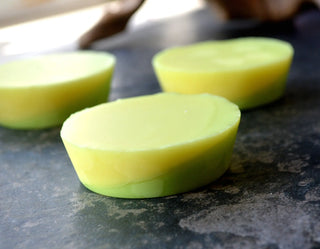 This specialty two-tone lotion bar is scented with lemon, basil, and rosemary essential oils.